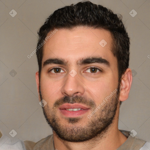 Joyful white young-adult male with short  black hair and brown eyes