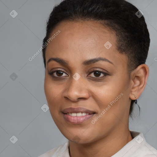 Joyful black young-adult female with short  black hair and brown eyes