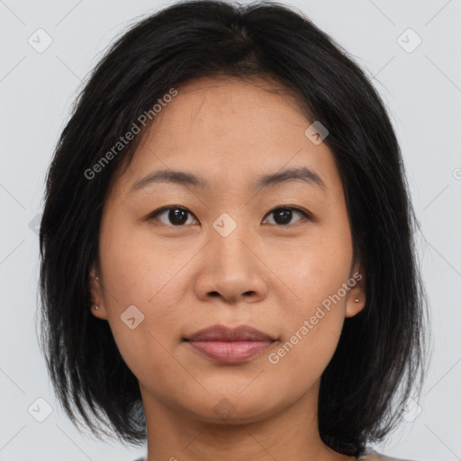 Joyful asian young-adult female with medium  brown hair and brown eyes