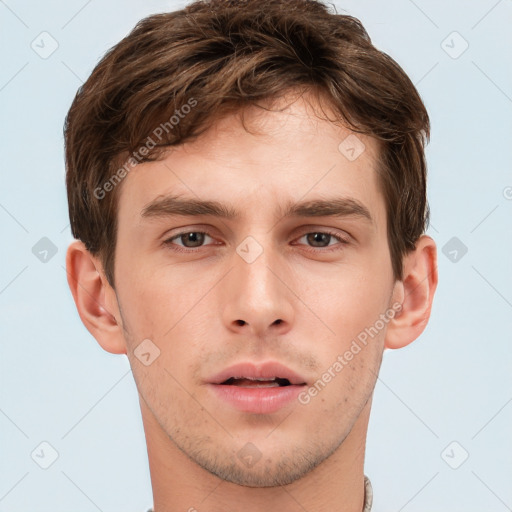 Neutral white young-adult male with short  brown hair and brown eyes