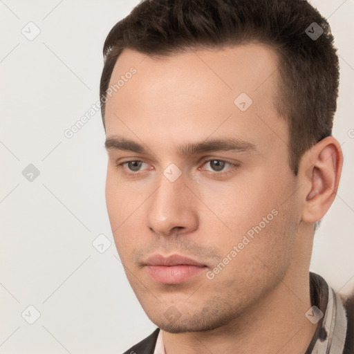 Neutral white young-adult male with short  brown hair and brown eyes