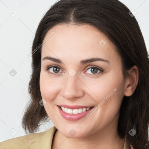 Joyful white young-adult female with medium  brown hair and brown eyes