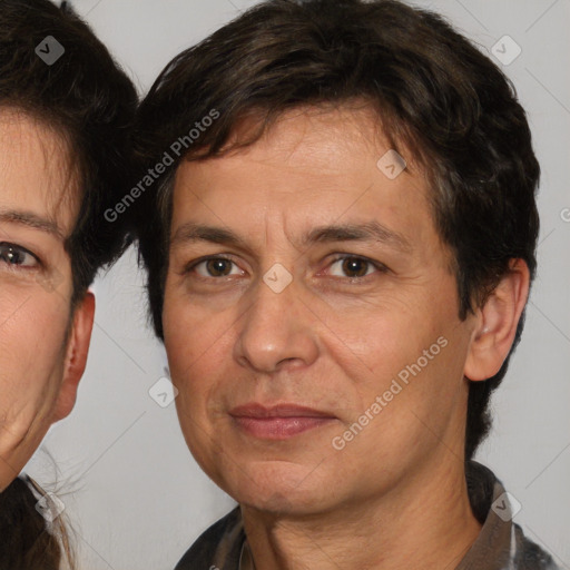 Joyful white adult male with medium  brown hair and brown eyes