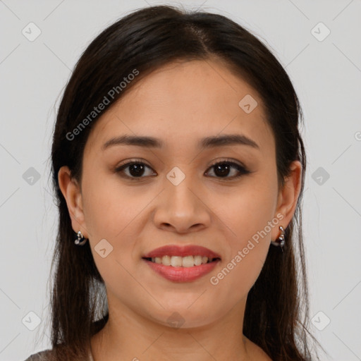 Joyful latino young-adult female with medium  brown hair and brown eyes