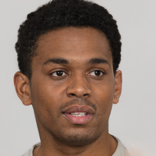 Neutral black young-adult male with short  brown hair and brown eyes