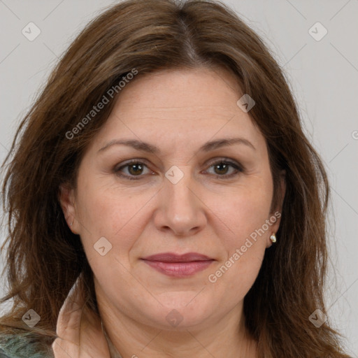 Joyful white adult female with long  brown hair and brown eyes