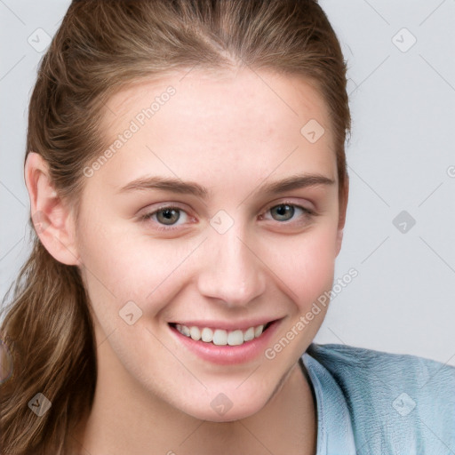 Joyful white young-adult female with long  brown hair and blue eyes