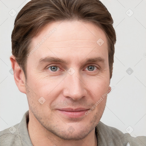 Joyful white adult male with short  brown hair and grey eyes