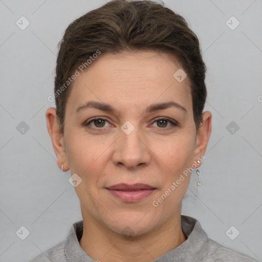 Joyful white adult female with short  brown hair and grey eyes