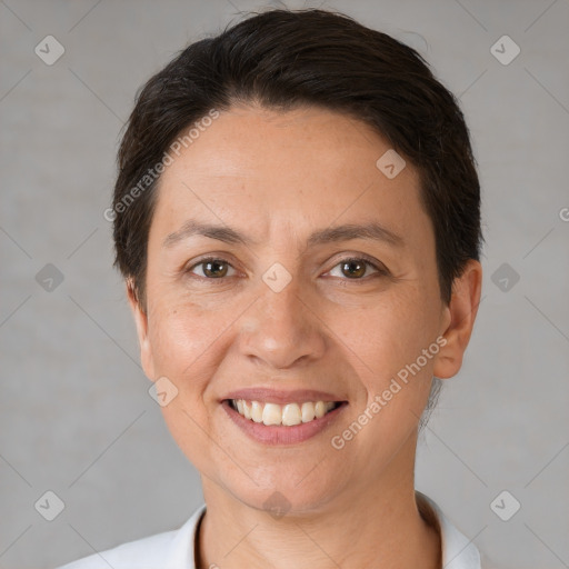 Joyful white adult female with short  brown hair and brown eyes