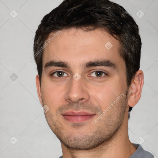 Joyful white young-adult male with short  brown hair and brown eyes