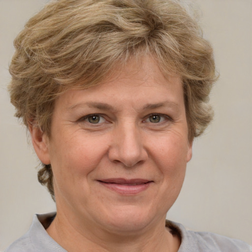 Joyful white adult female with short  brown hair and grey eyes