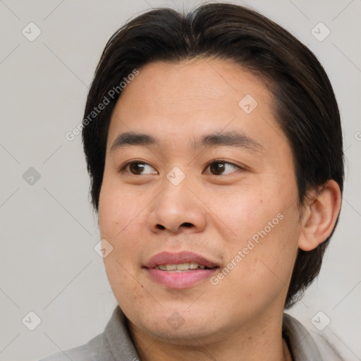 Joyful asian young-adult male with short  brown hair and brown eyes