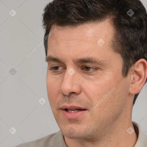 Joyful white adult male with short  brown hair and brown eyes