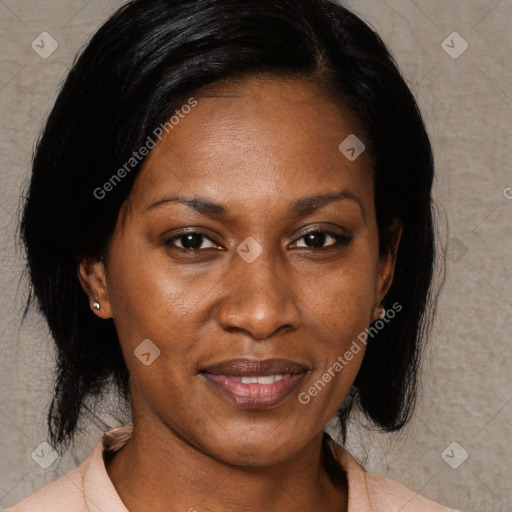 Joyful black adult female with medium  brown hair and brown eyes