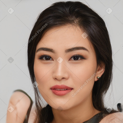 Joyful asian young-adult female with medium  brown hair and brown eyes