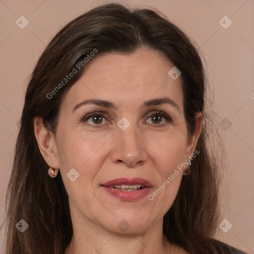 Joyful white adult female with medium  brown hair and brown eyes