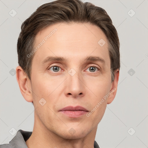 Joyful white adult male with short  brown hair and grey eyes