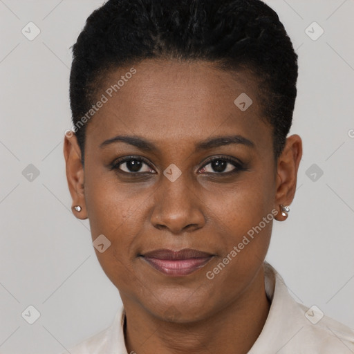 Joyful black young-adult female with short  black hair and brown eyes