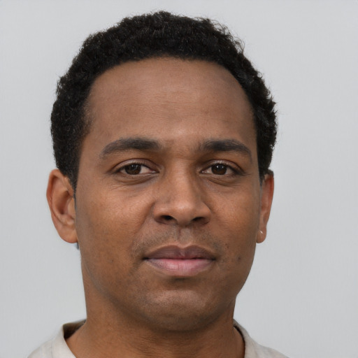 Neutral latino young-adult male with short  brown hair and brown eyes