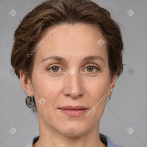 Joyful white adult female with short  brown hair and grey eyes