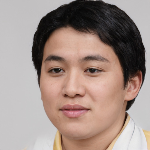 Joyful asian young-adult male with short  brown hair and brown eyes