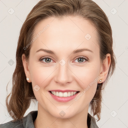 Joyful white young-adult female with medium  brown hair and blue eyes