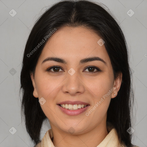 Joyful latino young-adult female with medium  brown hair and brown eyes