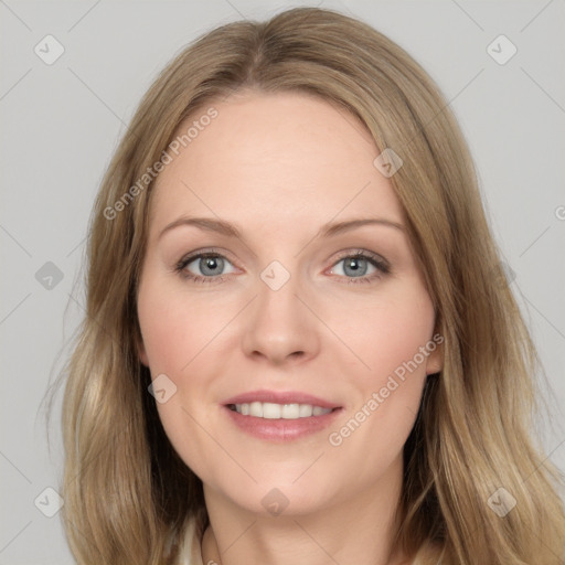 Joyful white adult female with long  brown hair and grey eyes