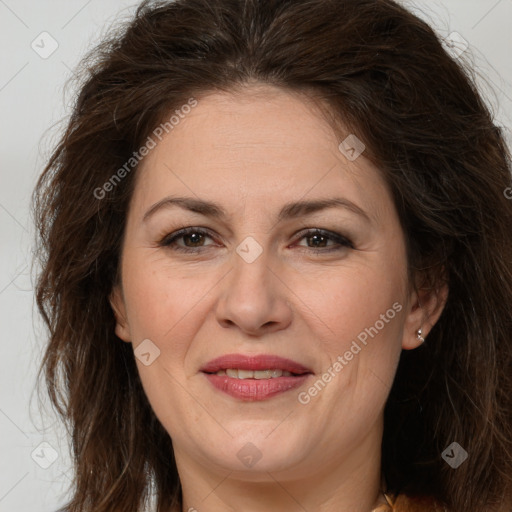 Joyful white adult female with long  brown hair and brown eyes