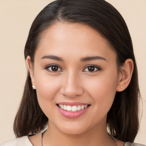 Joyful white young-adult female with long  brown hair and brown eyes