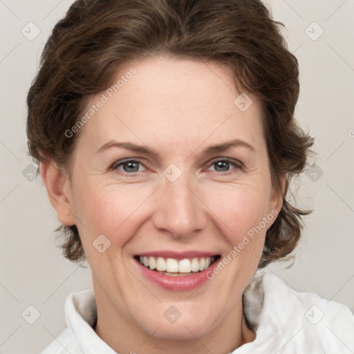 Joyful white adult female with short  brown hair and grey eyes