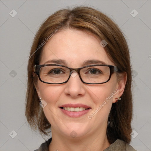 Joyful white adult female with medium  brown hair and blue eyes