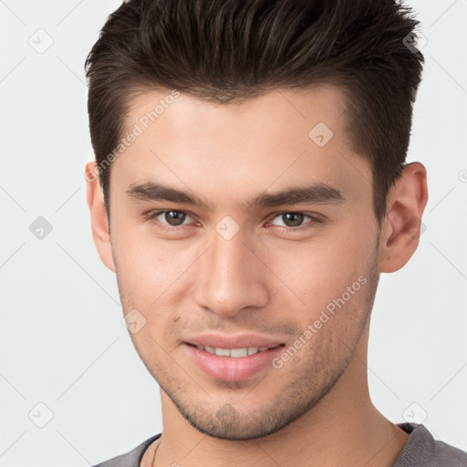 Joyful white young-adult male with short  brown hair and brown eyes