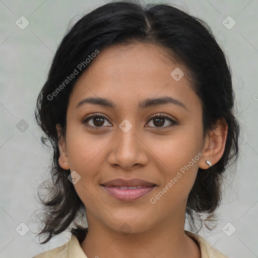 Joyful latino young-adult female with medium  brown hair and brown eyes