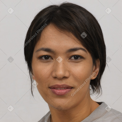 Joyful asian young-adult female with medium  black hair and brown eyes