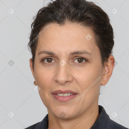 Joyful white adult female with short  brown hair and brown eyes