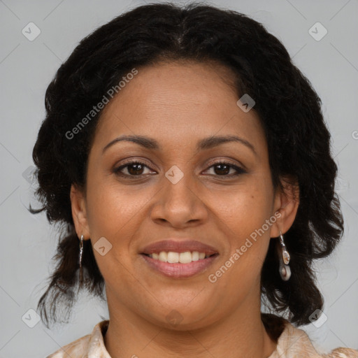 Joyful black adult female with medium  brown hair and brown eyes