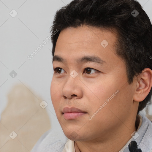 Neutral white young-adult male with short  black hair and brown eyes