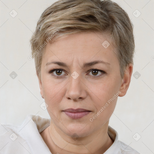 Joyful white adult female with short  brown hair and brown eyes