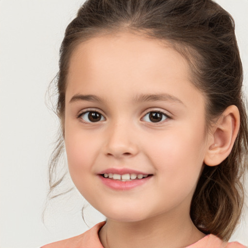 Joyful white child female with medium  brown hair and brown eyes