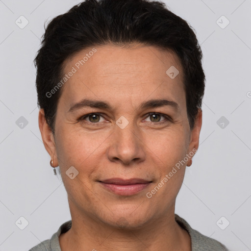 Joyful white adult female with short  brown hair and brown eyes