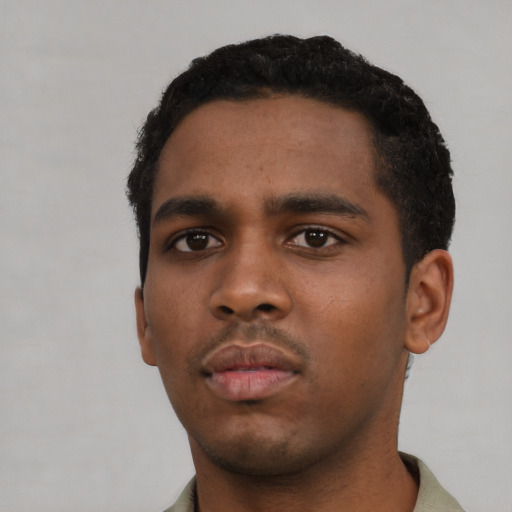 Neutral black young-adult male with short  black hair and brown eyes