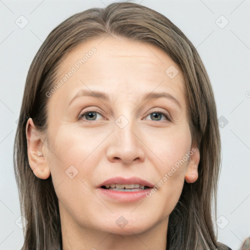 Joyful white adult female with long  brown hair and grey eyes