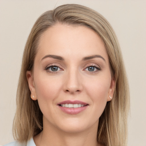 Joyful white young-adult female with long  brown hair and grey eyes