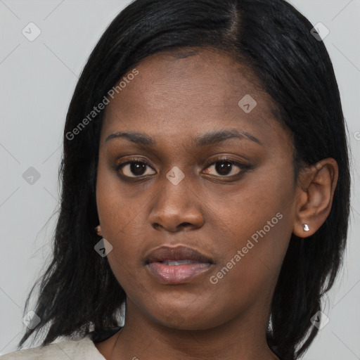 Joyful black young-adult female with medium  black hair and brown eyes