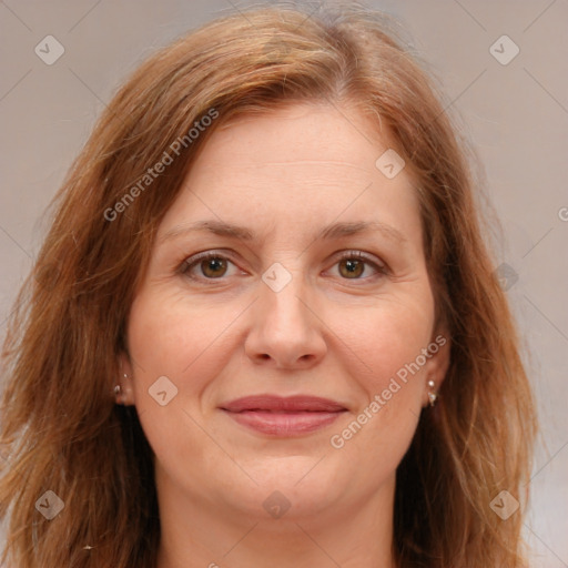 Joyful white adult female with long  brown hair and brown eyes