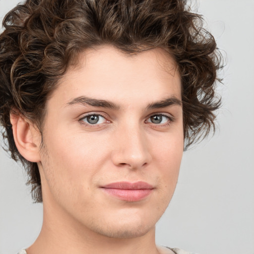 Joyful white young-adult male with medium  brown hair and brown eyes