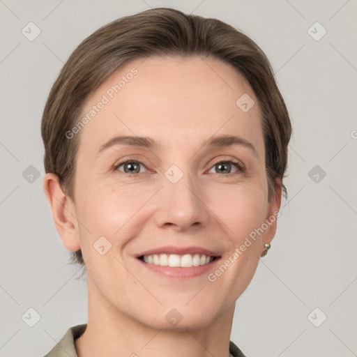 Joyful white young-adult female with short  brown hair and grey eyes