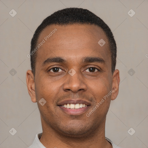 Joyful latino young-adult male with short  brown hair and brown eyes